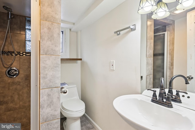 bathroom with tile patterned flooring, sink, and toilet