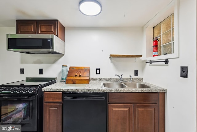 kitchen with sink and black appliances