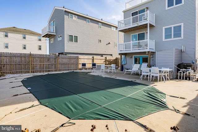 view of pool featuring a patio and a fenced backyard