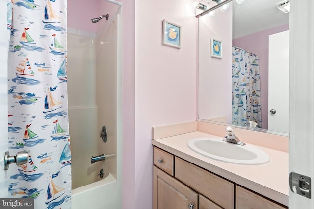 full bathroom with visible vents, vanity, and shower / tub combo