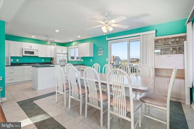 dining space featuring light tile patterned floors, recessed lighting, and a ceiling fan