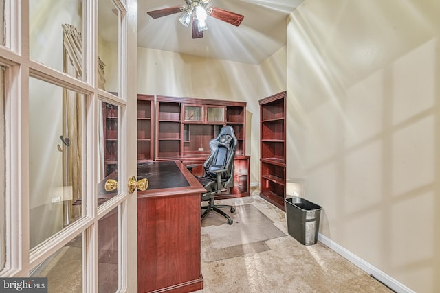 carpeted home office featuring ceiling fan and high vaulted ceiling