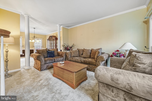 carpeted living room featuring ornate columns, crown molding, and a chandelier