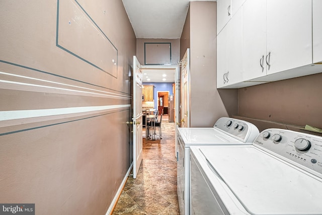 laundry area with cabinets and independent washer and dryer