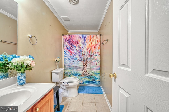 bathroom with tile patterned floors, vanity, toilet, and ornamental molding