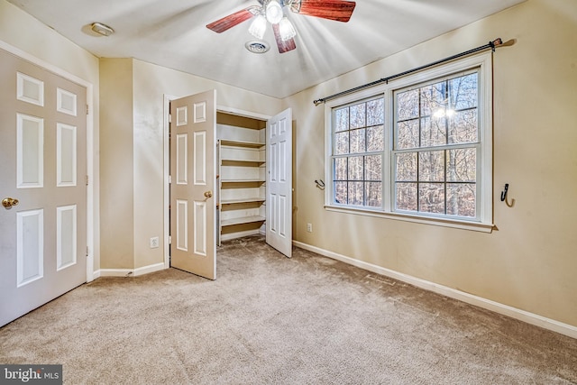 unfurnished bedroom featuring ceiling fan and light colored carpet