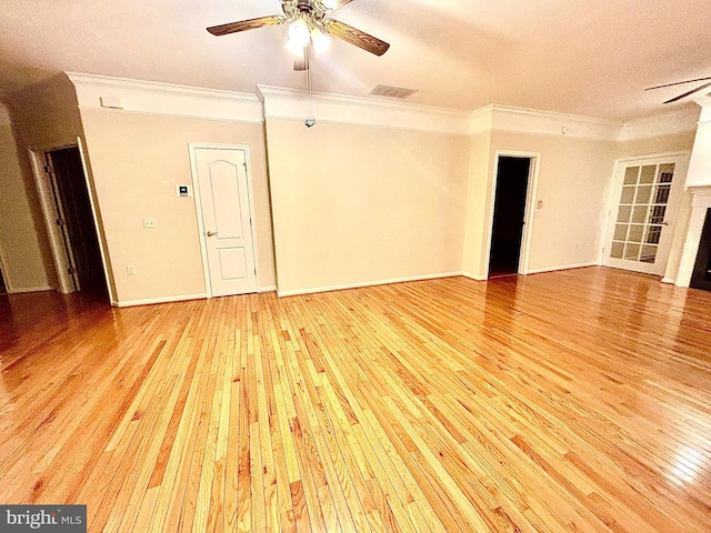 empty room with ceiling fan, light hardwood / wood-style flooring, a textured ceiling, and ornamental molding