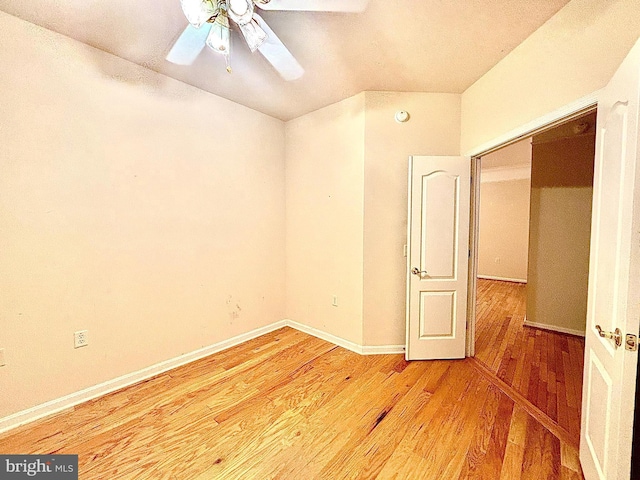 spare room featuring hardwood / wood-style floors and ceiling fan