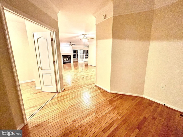 hallway with light hardwood / wood-style flooring