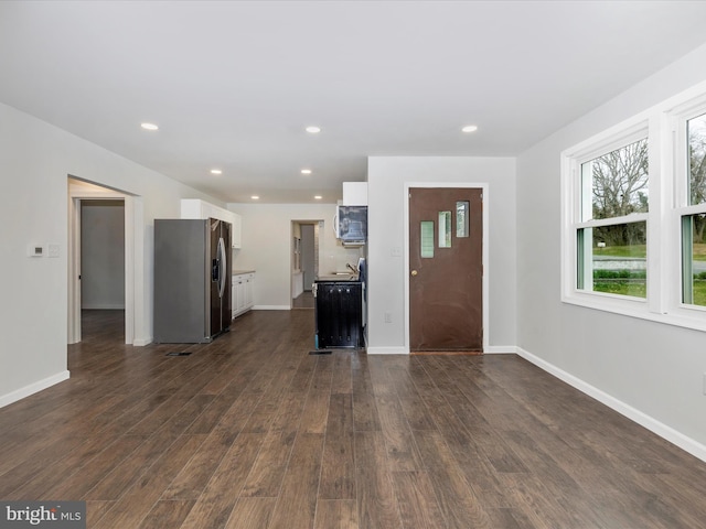 9732 Garis Shop Rd, Hagerstown, MD 21740 - unfurnished living room featuring dark wood-type flooring, baseboards, recessed lighting, and a sink