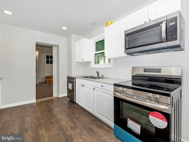 9732 Garis Shop Rd, Hagerstown, MD 21740 - kitchen with stainless steel appliances, dark wood-style floors, white cabinets, and recessed lighting