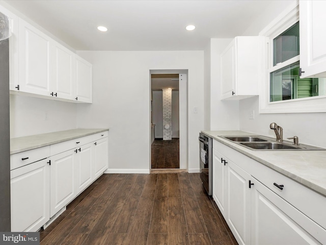 9732 Garis Shop Rd, Hagerstown, MD 21740 - kitchen featuring a sink, dark wood-type flooring, baseboards, white cabinetry, and light countertops