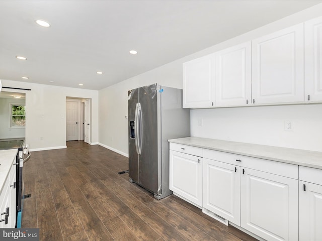 9732 Garis Shop Rd, Hagerstown, MD 21740 - kitchen featuring appliances with stainless steel finishes, white cabinetry, dark wood-style flooring, light countertops, and recessed lighting