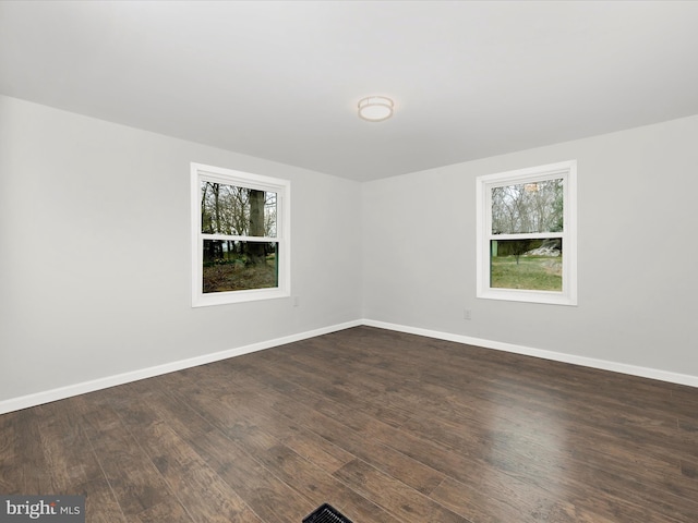 9732 Garis Shop Rd, Hagerstown, MD 21740 - unfurnished room with healthy amount of natural light, dark wood finished floors, and baseboards
