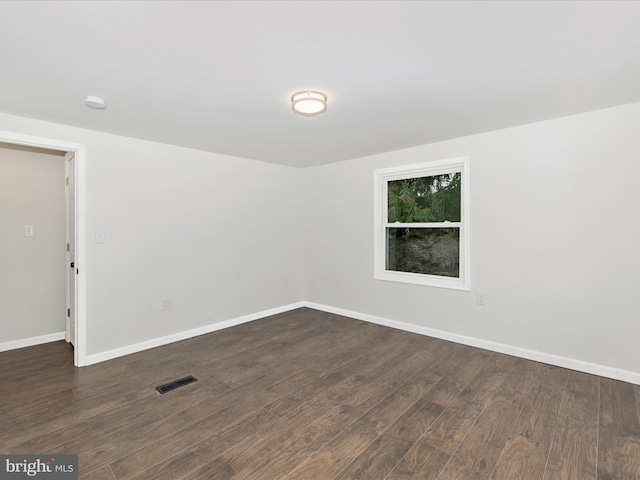 9732 Garis Shop Rd, Hagerstown, MD 21740 - empty room featuring dark wood-type flooring, baseboards, and a smoke detector