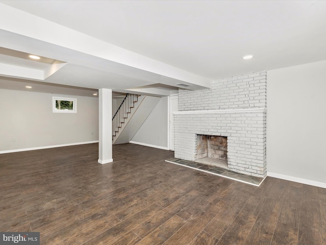 9732 Garis Shop Rd, Hagerstown, MD 21740 - below grade area with a brick fireplace, wood finished floors, baseboards, stairway, and recessed lighting