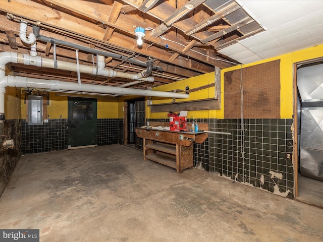 9732 Garis Shop Rd, Hagerstown, MD 21740 - miscellaneous room with electric panel, unfinished concrete floors, and a workshop area