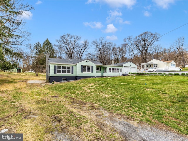 9732 Garis Shop Rd, Hagerstown, MD 21740 - back of house with a garage, a chimney, and a yard