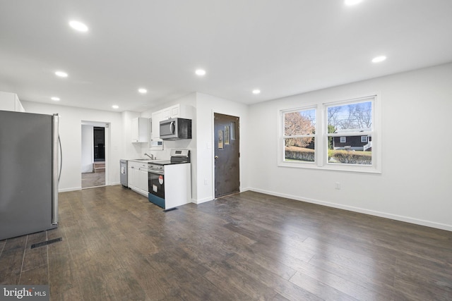 9732 Garis Shop Rd, Hagerstown, MD 21740 - kitchen with appliances with stainless steel finishes, a sink, recessed lighting, dark wood-style flooring, and white cabinets