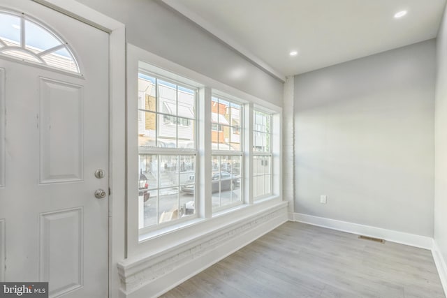 entryway with light hardwood / wood-style floors