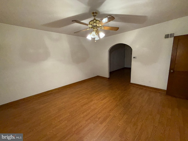 spare room with wood-type flooring and ceiling fan