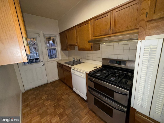 kitchen with gas stove, sink, dishwasher, ventilation hood, and backsplash