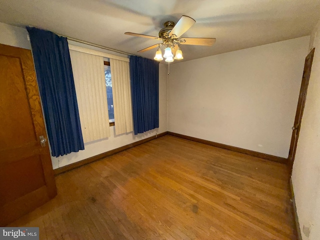 empty room with wood-type flooring and ceiling fan