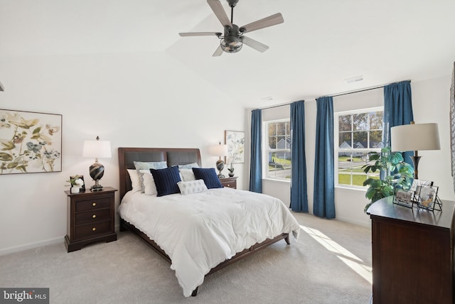 carpeted bedroom with ceiling fan and lofted ceiling