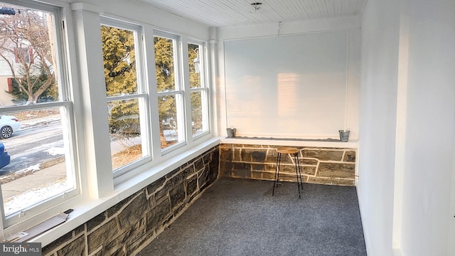 unfurnished sunroom featuring a wealth of natural light