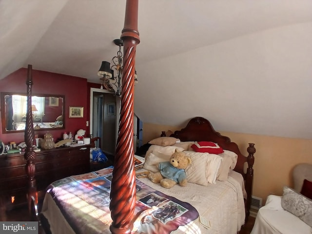 bedroom featuring lofted ceiling