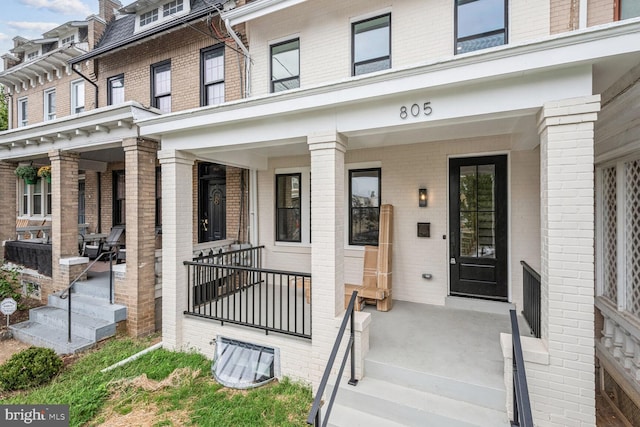 entrance to property with a porch