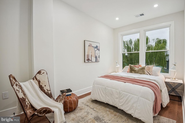 bedroom with wood-type flooring