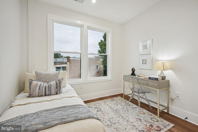 bedroom featuring dark hardwood / wood-style floors