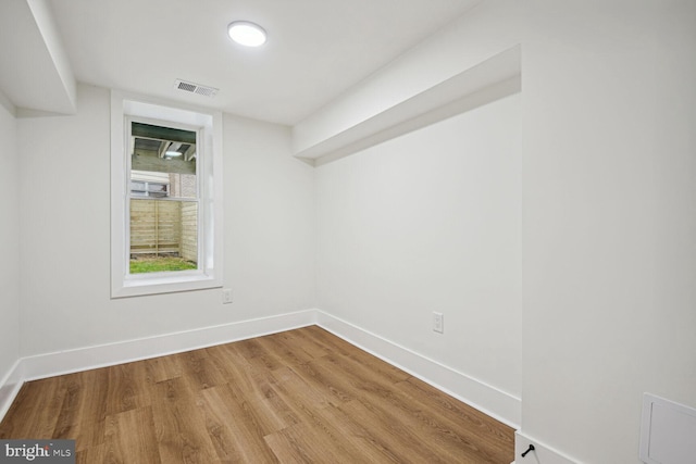 empty room featuring wood-type flooring