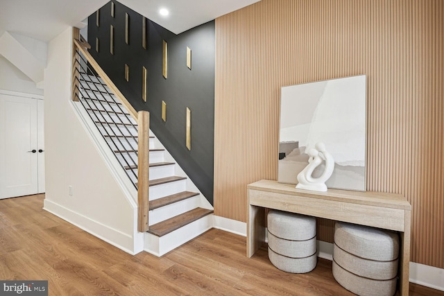 stairway with hardwood / wood-style flooring