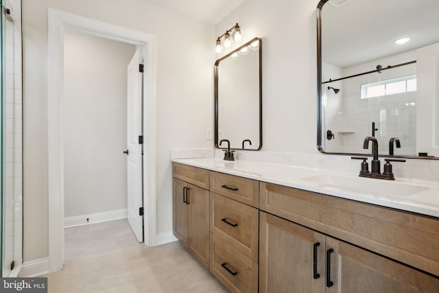 bathroom featuring vanity and a shower with shower door