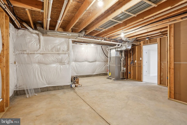 basement featuring heating unit