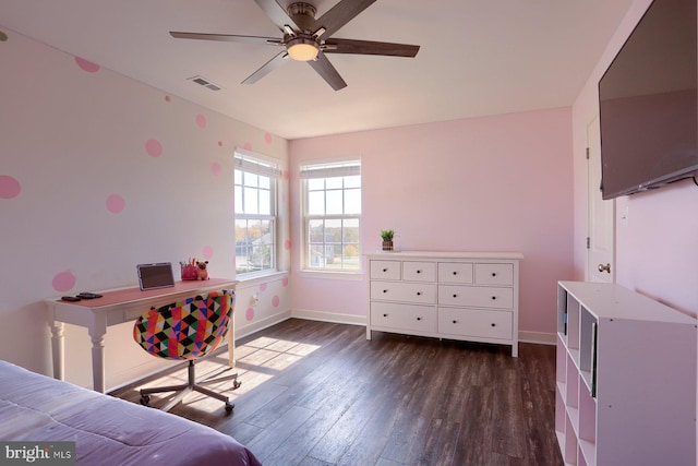 bedroom with dark hardwood / wood-style flooring and ceiling fan