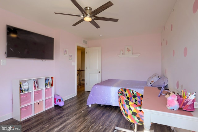 bedroom with dark hardwood / wood-style floors and ceiling fan