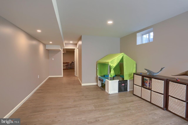 basement featuring light wood-type flooring