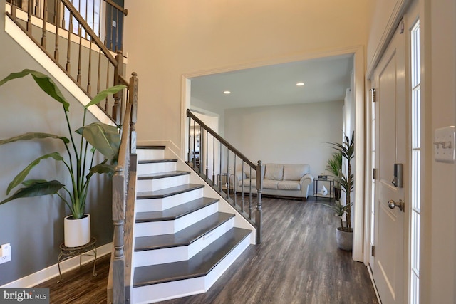 entrance foyer with dark hardwood / wood-style flooring