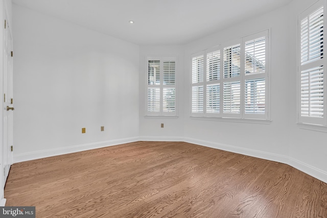 spare room featuring hardwood / wood-style flooring