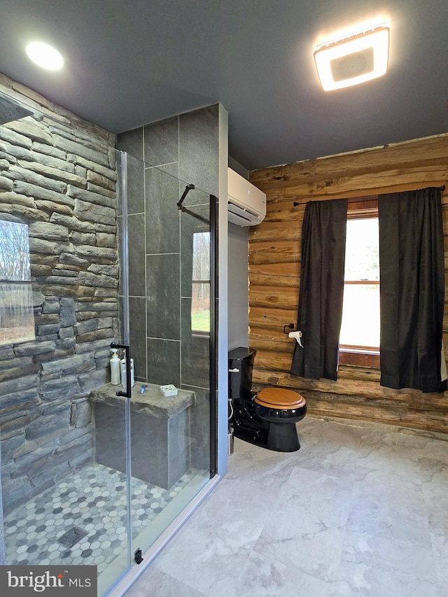 bathroom with toilet, a wall mounted AC, and a shower with shower door