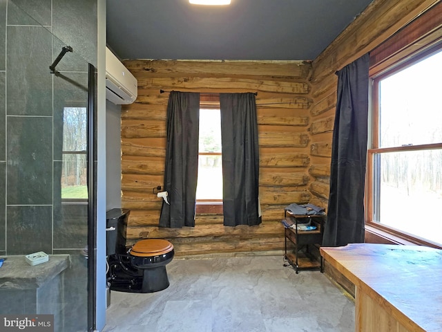 interior space with log walls, a wall mounted air conditioner, and toilet