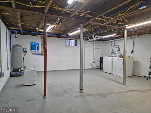 basement with washing machine and clothes dryer