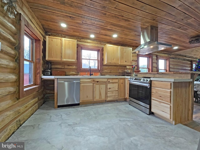 kitchen featuring kitchen peninsula, island range hood, and stainless steel appliances