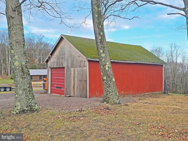 view of outbuilding with a lawn