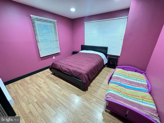 bedroom with light hardwood / wood-style flooring