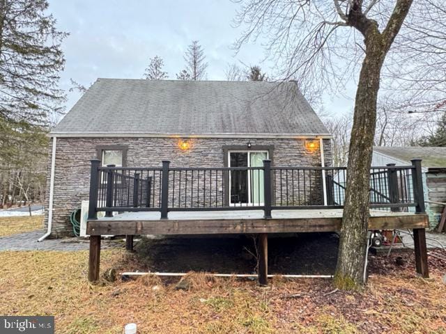 back of property with a deck