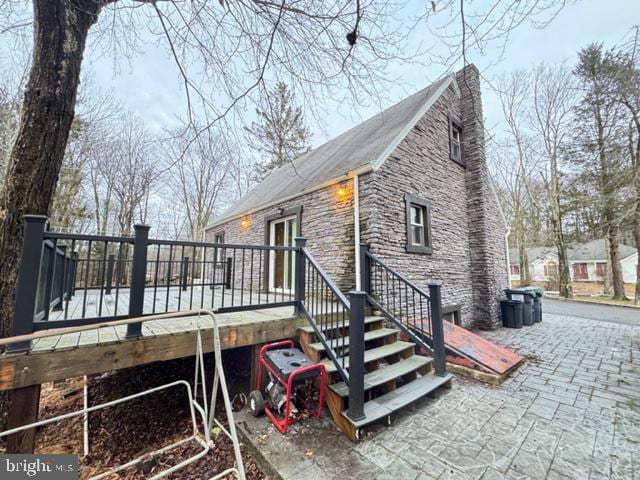 view of property exterior featuring a deck